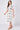 Cream sun print midi shirt dress angled front view