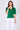 Green satin tie front short sleeve top hands in pockets